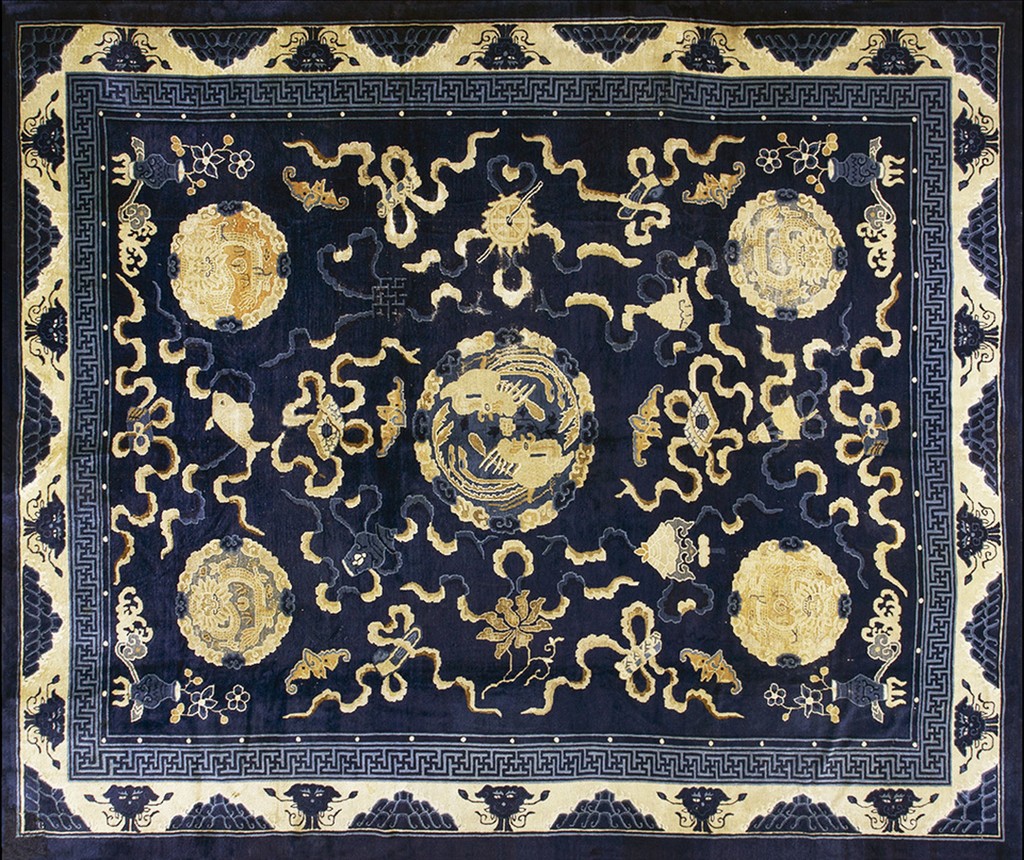 An antique chinese peking rug featuring five golden circular medallions and abstract floral elements on a deep navy blue ground, framed by an ivory geometric border, by rugs on net.