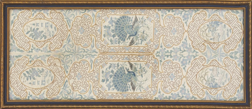 A framed antique chinese textile panel with an ivory background featuring blue embroidery of cranes, floral patterns, and geometric shou borders, peacock designs by rugs on net.