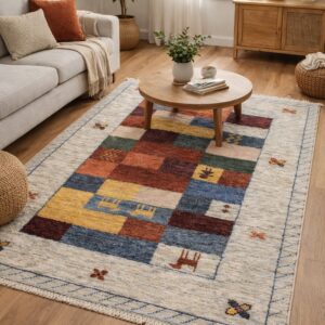Beige rug featuring abrash stripes, primitive figures, and a red geometric border in a sunlit room.