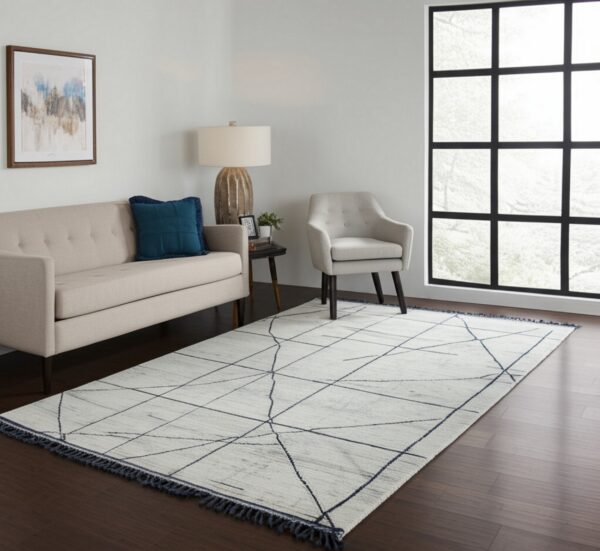 Low-pile light gray rug with subtle linear pattern in a contemporary, brightly lit room.