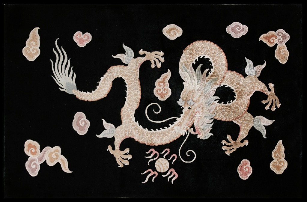 A vintage chinese rug on a black background featuring a large, intricately detailed five-claw dragon in cream and pale pink hues, surrounded by swirling pastel cloud shapes by rugs on net.