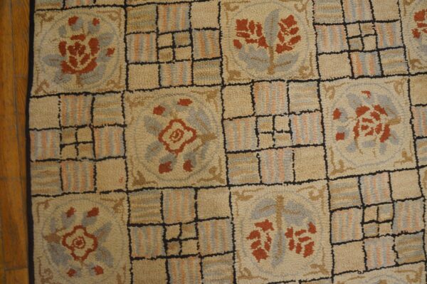 Close-up of a beige hooked rug with repeating floral medallions and grid pattern, by rugs on net