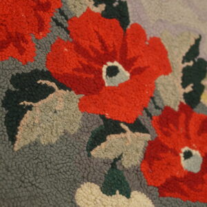 Close-up of red floral pattern on a textured rug by Rugs On Net