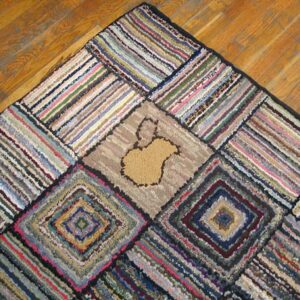 Close-up of a colorful, scrappy rag rug with geometric patterns and a central tan shape, by Rugs On Net