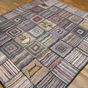 A colorful, square patchwork rug with diamond patterns and small pictorial elements on a wooden floor, by Rugs On Net