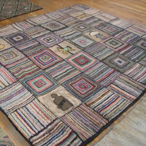 A colorful, square rag rug with a patchwork design featuring concentric squares and small pictorial elements like a rocking horse, by Rugs On Net. by Rugs On Net