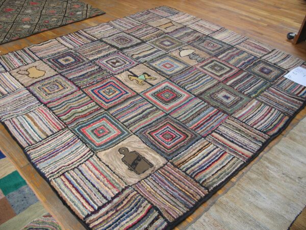 A colorful, square rag rug with a patchwork design featuring concentric squares and small pictorial elements like a rocking horse, by rugs on net. By rugs on net