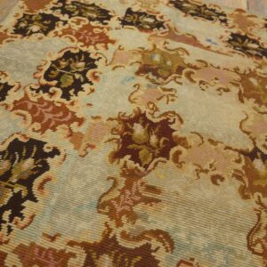 Close-up of a light-colored rug with brown and muted floral patterns, by Rugs On Net
