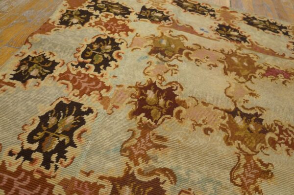 Close-up of a light-colored rug with brown and muted floral patterns, by rugs on net