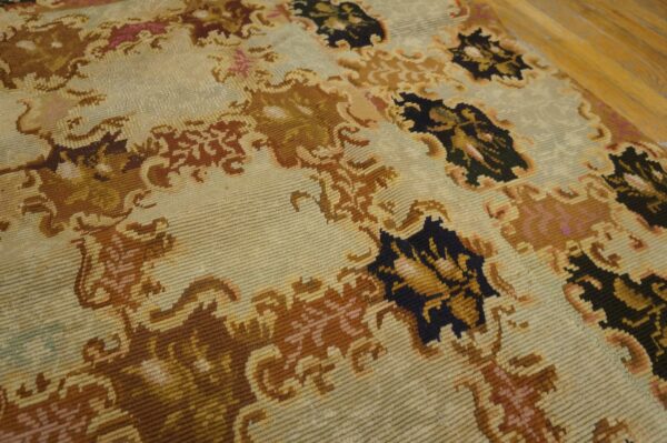 Close-up of a light-colored rug with brown and dark accents, showcasing the texture of the aubusson style rug by rugs on net. By rugs on net