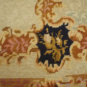 Close-up of a tapestry rug showing beige, brown, and dark blue floral patterns by Rugs On Net. by Rugs On Net