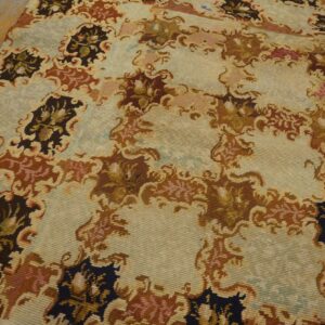 Close-up of a light-colored rug with abstract brown and dark floral motifs by Rugs On Net