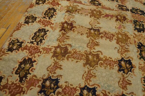 Close-up of a light-colored rug with abstract brown and dark floral motifs by rugs on net
