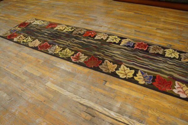 A runner rug with colorful autumn leaves border on a dark, wavy background, by rugs on net