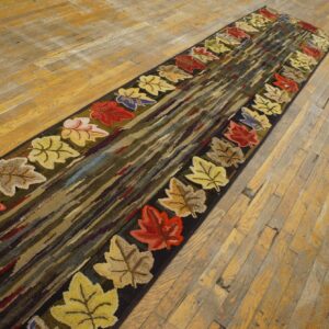 A long runner rug featuring colorful autumn leaves bordering a center of dark, striated colors, by Rugs On Net. by Rugs On Net