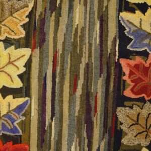 Close-up of a hooked rug featuring colorful autumn leaves against a striped, earthy-toned background, by Rugs On Net