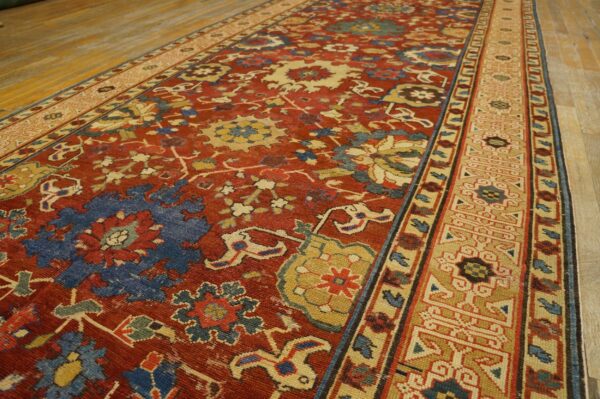 Close-up of a richly colored runner rug with red, blue, and gold patterns, by rugs on net. By rugs on net