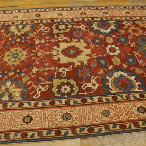 Close-up of a richly colored red rug with intricate floral and geometric patterns, featuring blue and beige accents, by Rugs On Net