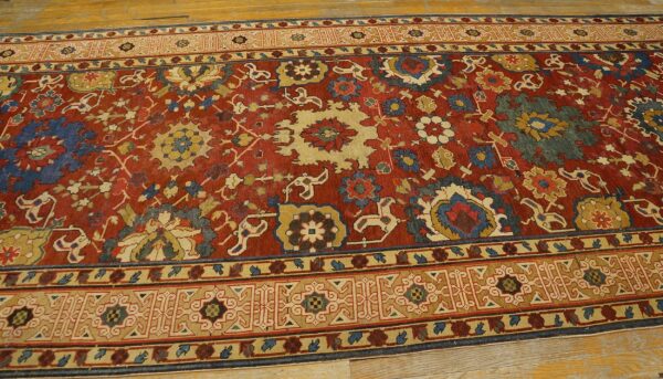 Close-up of a richly colored red rug with intricate floral and geometric patterns, featuring blue and beige accents, by rugs on net