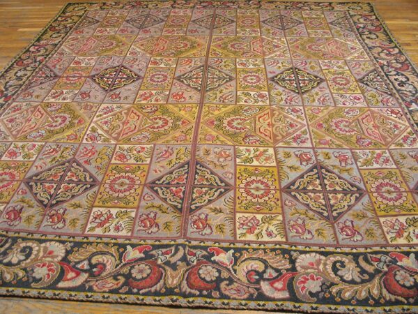 A large, colorful tapestry rug with a geometric patchwork design featuring floral motifs, by rugs on net. By rugs on net