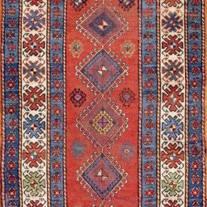 Antique 1900 Caucasian Kazak tribal geometric runner featuring cobalt blue accents and white stylized cross border Rug by Rugs On Net