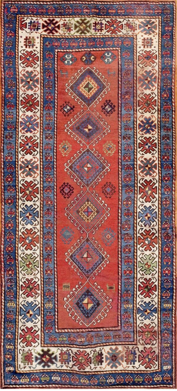 Antique 1900 caucasian kazak tribal geometric runner featuring cobalt blue accents and white stylized cross border rug by rugs on net