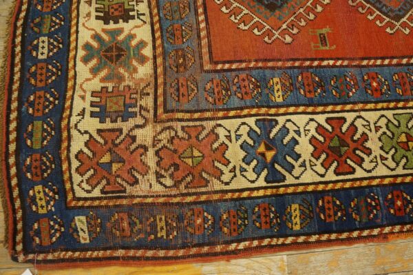 Close-up of the border of an antique caucasian rug by rugs on net. By rugs on net
