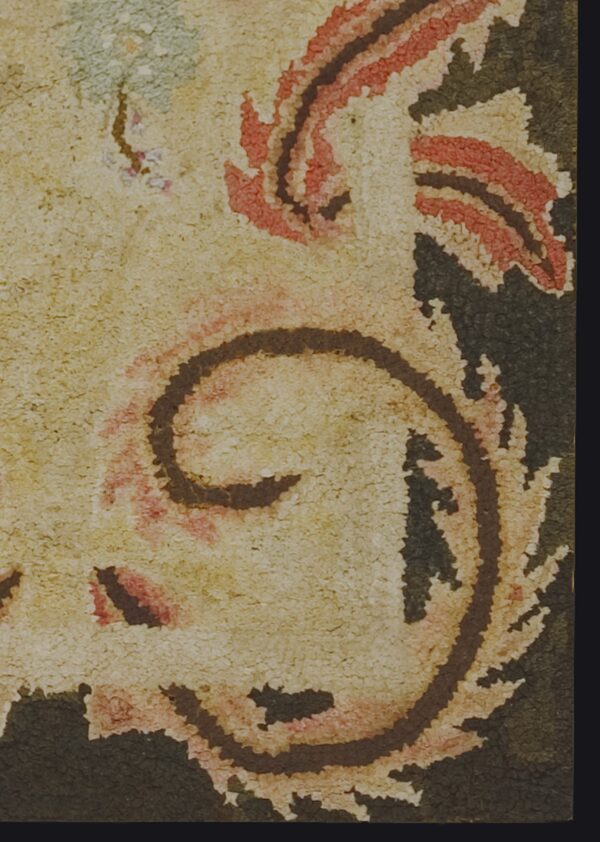 Close-up texture of a traditional rug with cream, red, and dark brown swirls by rugs on net