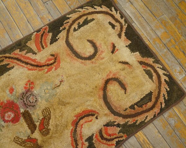 Close-up of a hooked rug with abstract floral and scroll patterns in earth tones, by rugs on net. By rugs on net