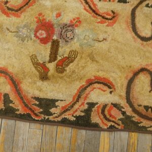 Close-up of a beige rug with floral and scrollwork details in red, brown, and green, by Rugs On Net