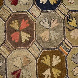 Colorful hexagonal patterned hooked rug