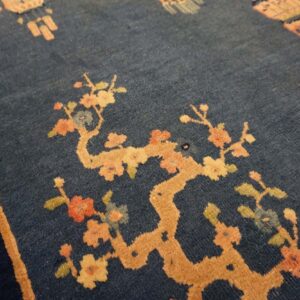 Dark blue dragon-patterned rug corner