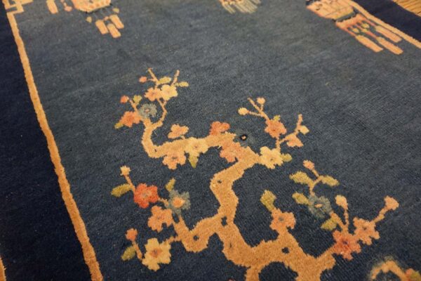 Dark blue dragon-patterned rug corner