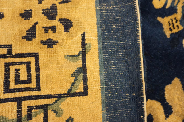 Intricate blue chinese carpet design.