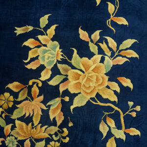 Blue rug with yellow floral design