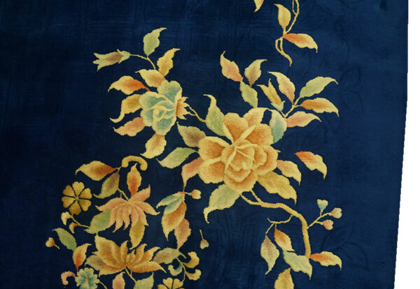 Blue rug with yellow floral design