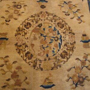 Close-up of a beige and brown floral pattern on an antique Chinese rug by Rugs On Net. by Rugs On Net