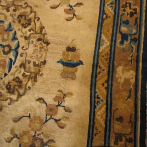 Close-up of an antique beige and brown rug detail by Rugs On Net