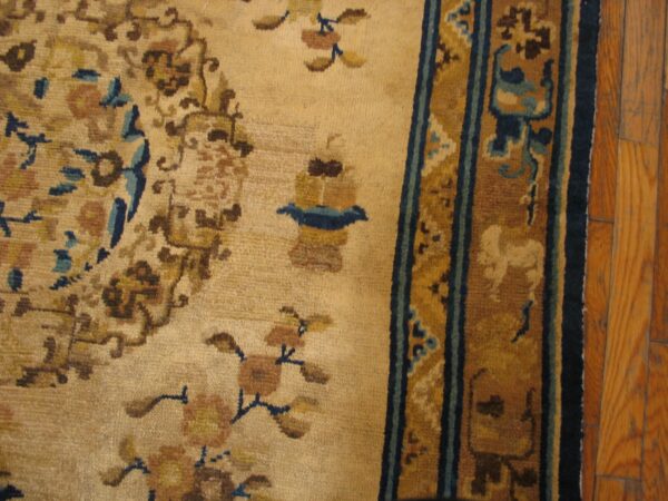 Close-up of an antique beige and brown rug detail by rugs on net
