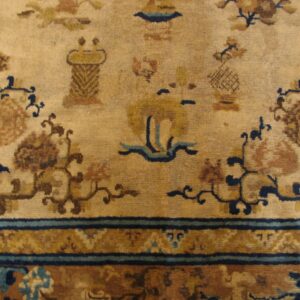 Close-up of a beige field with brown and blue motifs from the Antique Chinese Rug by Rugs On Net. by Rugs On Net