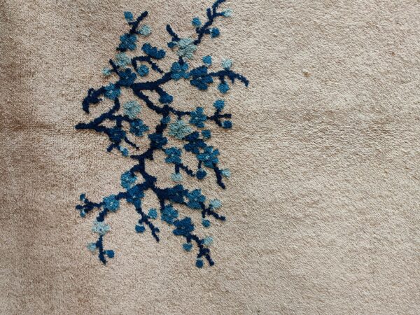 Blue vase design on beige carpet