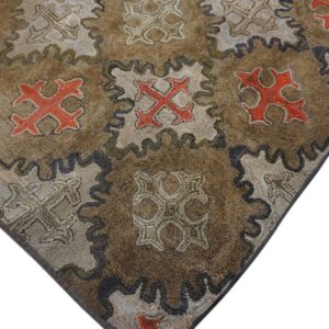 Close-up of a brown rug with repeating orange and beige geometric motifs by Rugs On Net