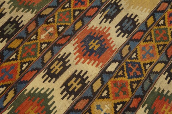 Close-up of diagonal geometric patterns in a colorful kilim rug by rugs on net. By rugs on net