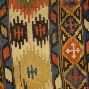 Close-up view of a colorful, geometric kilim rug pattern by Rugs On Net. by Rugs On Net