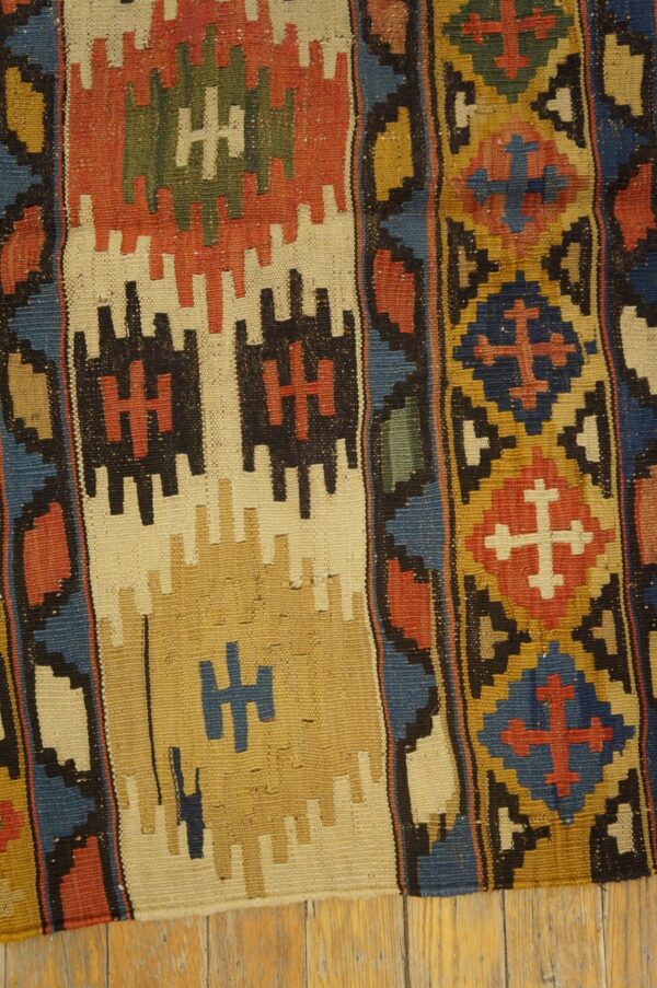 Close-up view of a colorful, geometric kilim rug pattern by rugs on net. By rugs on net