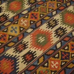 Close-up of a colorful Kilim rug with geometric patterns by Rugs On Net. by Rugs On Net