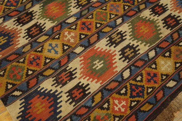 Close-up of a colorful kilim rug with geometric patterns by rugs on net. By rugs on net