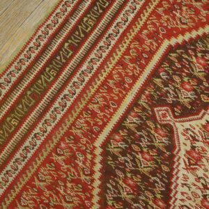 Close-up of the vibrant red and brown patterns on the Kilim rug by Rugs On Net. by Rugs On Net