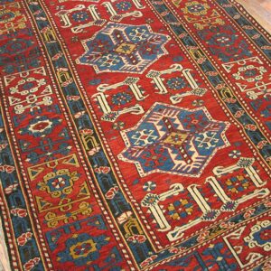 Close-up of a vibrant red and blue geometric runner rug by Rugs On Net. by Rugs On Net
