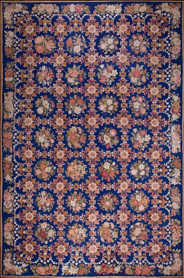 Floral pattern on blue background. Antique european needlepoint rug 13'6" x 20'6"